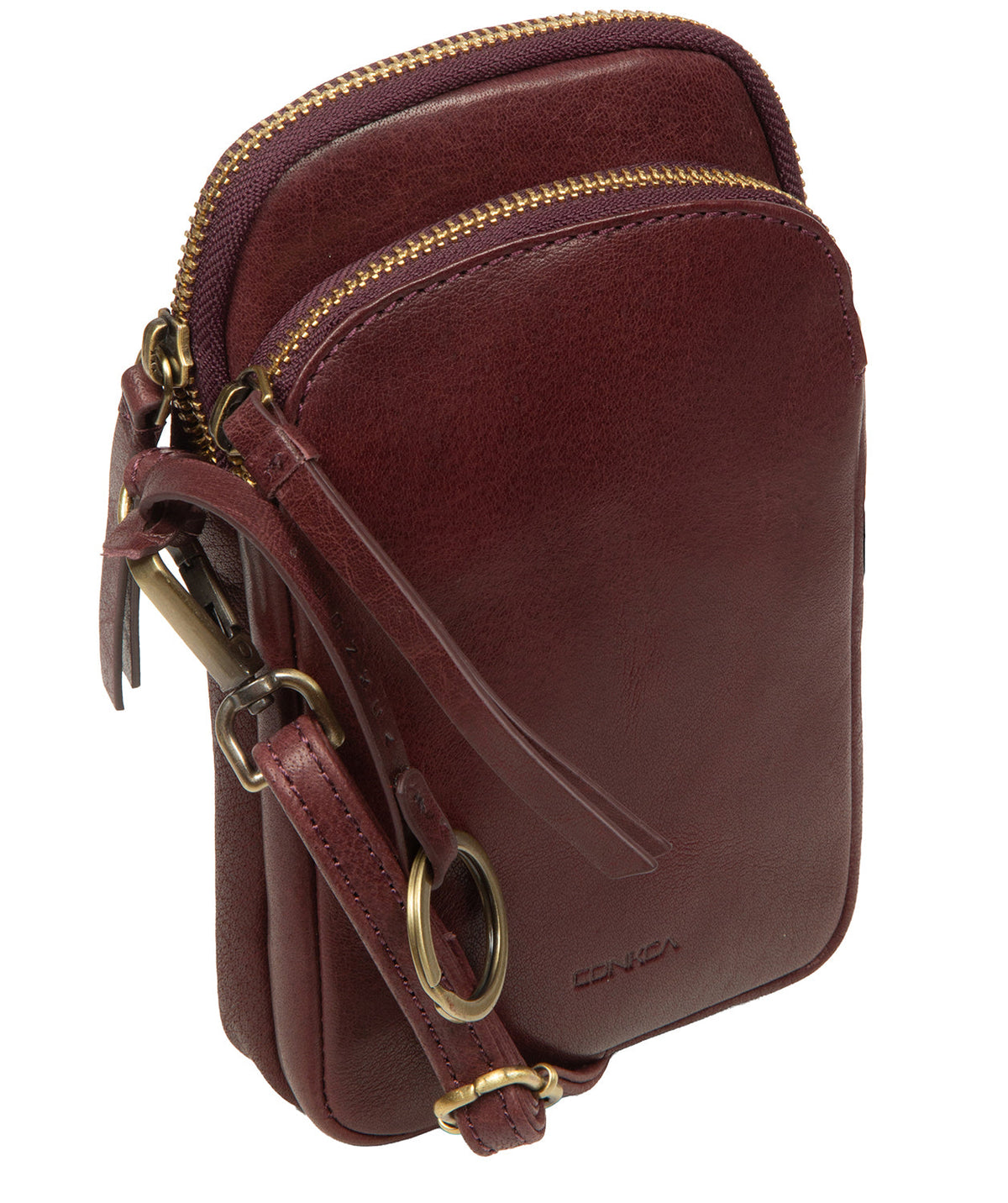 Embossed Conkca charm and logo close-up