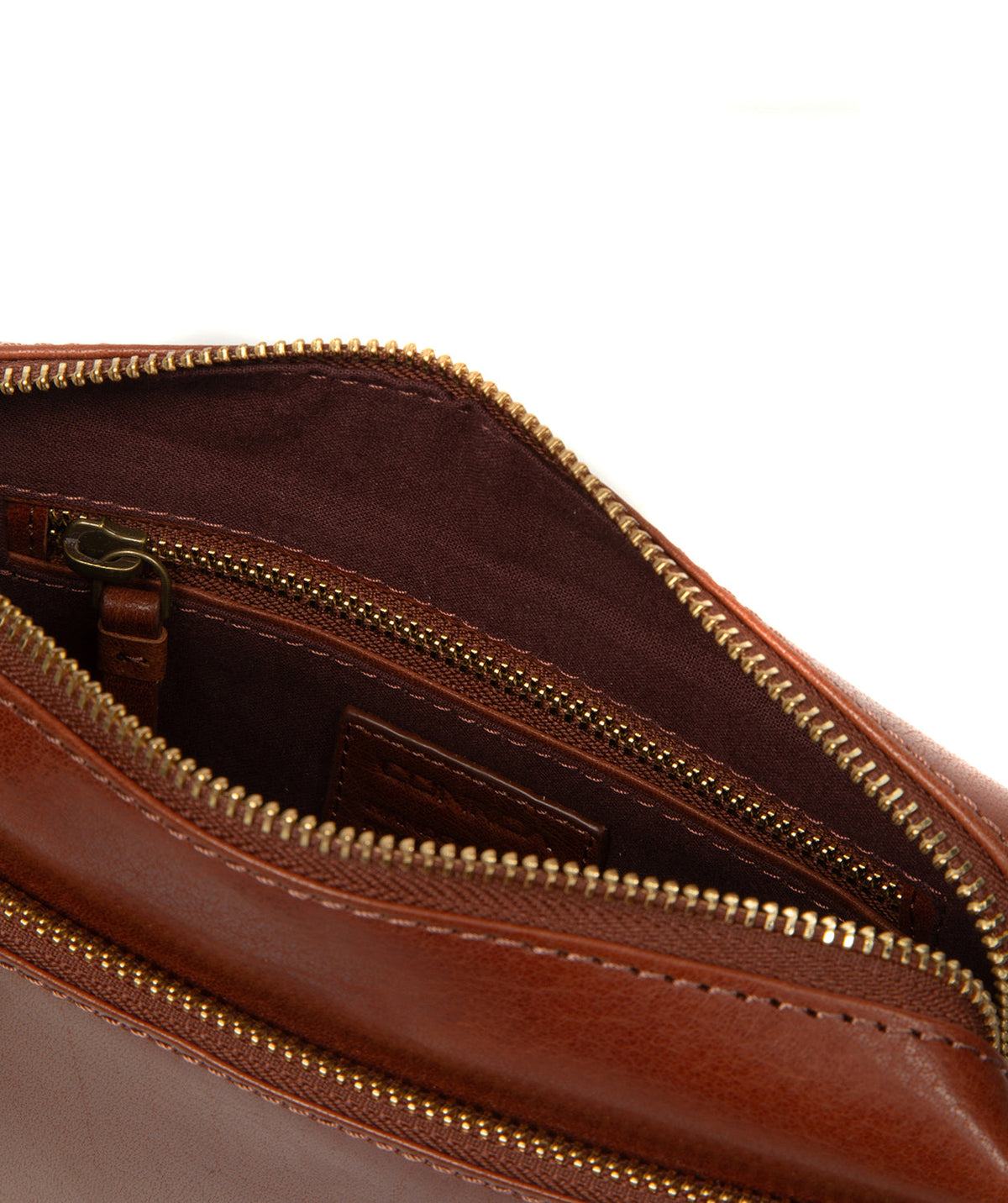 Exterior zipped pocket detail and brass hardware