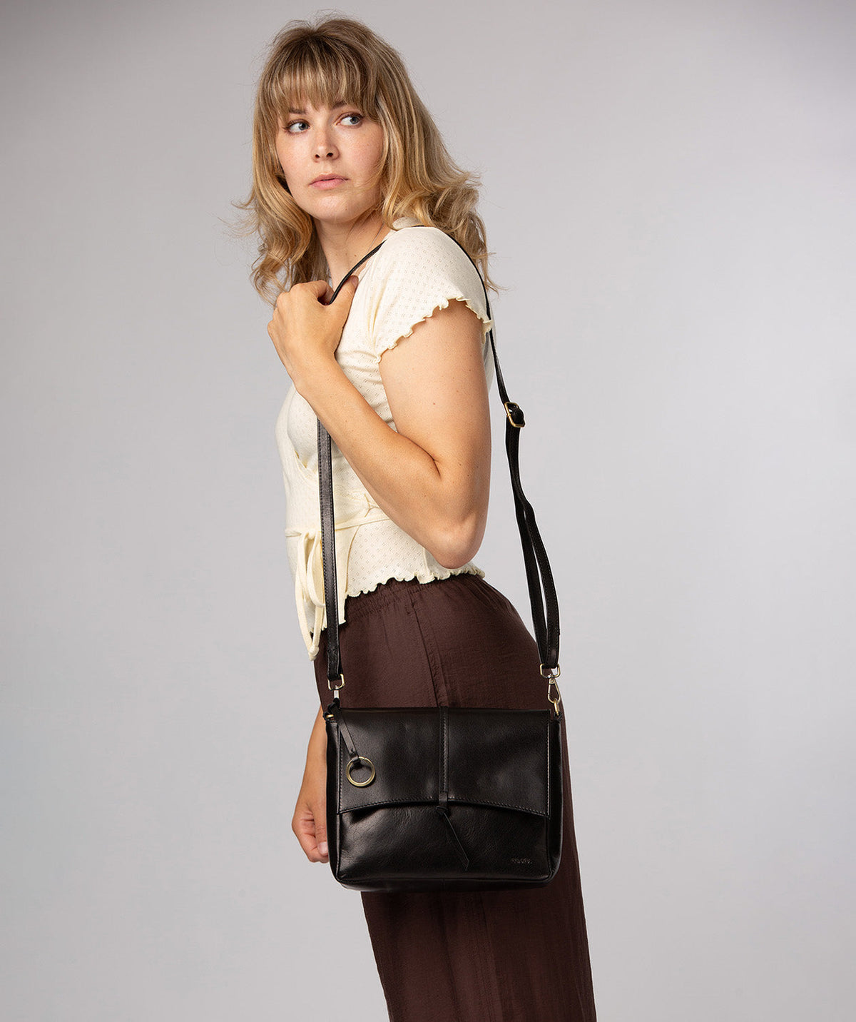 Rear slip pocket and adjustable leather shoulder strap