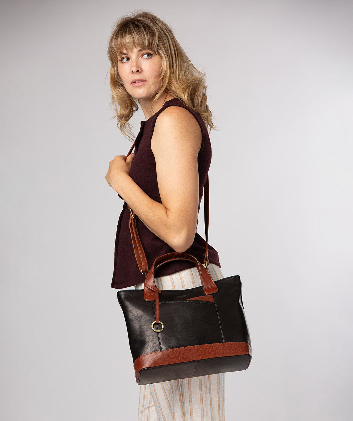 front overlay slip pocket detail with brass fittings