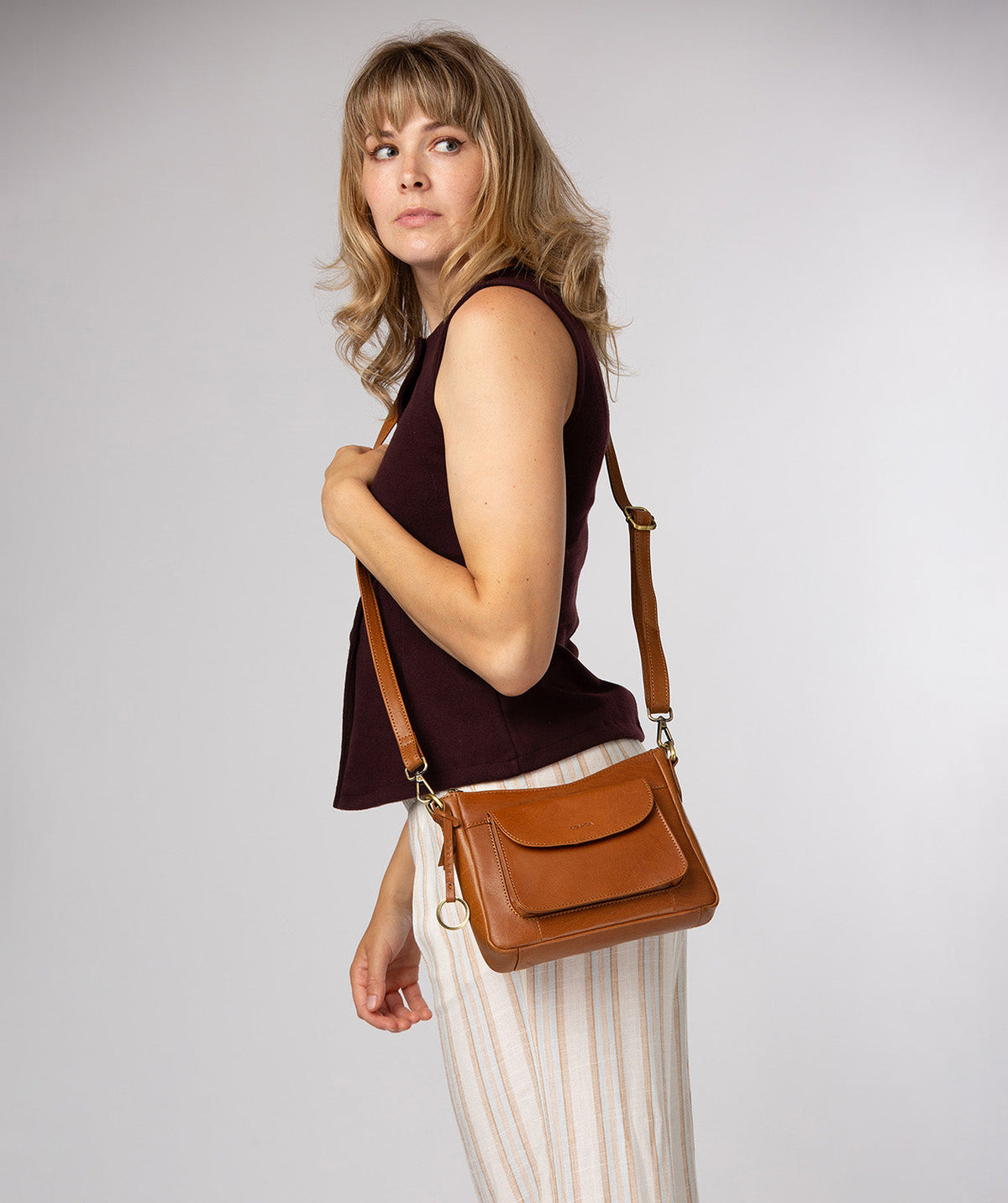 Conkca London Misty dark tan leather crossbody bag front view