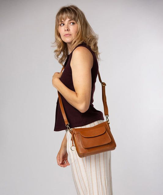 Conkca London Misty dark tan leather crossbody bag front view