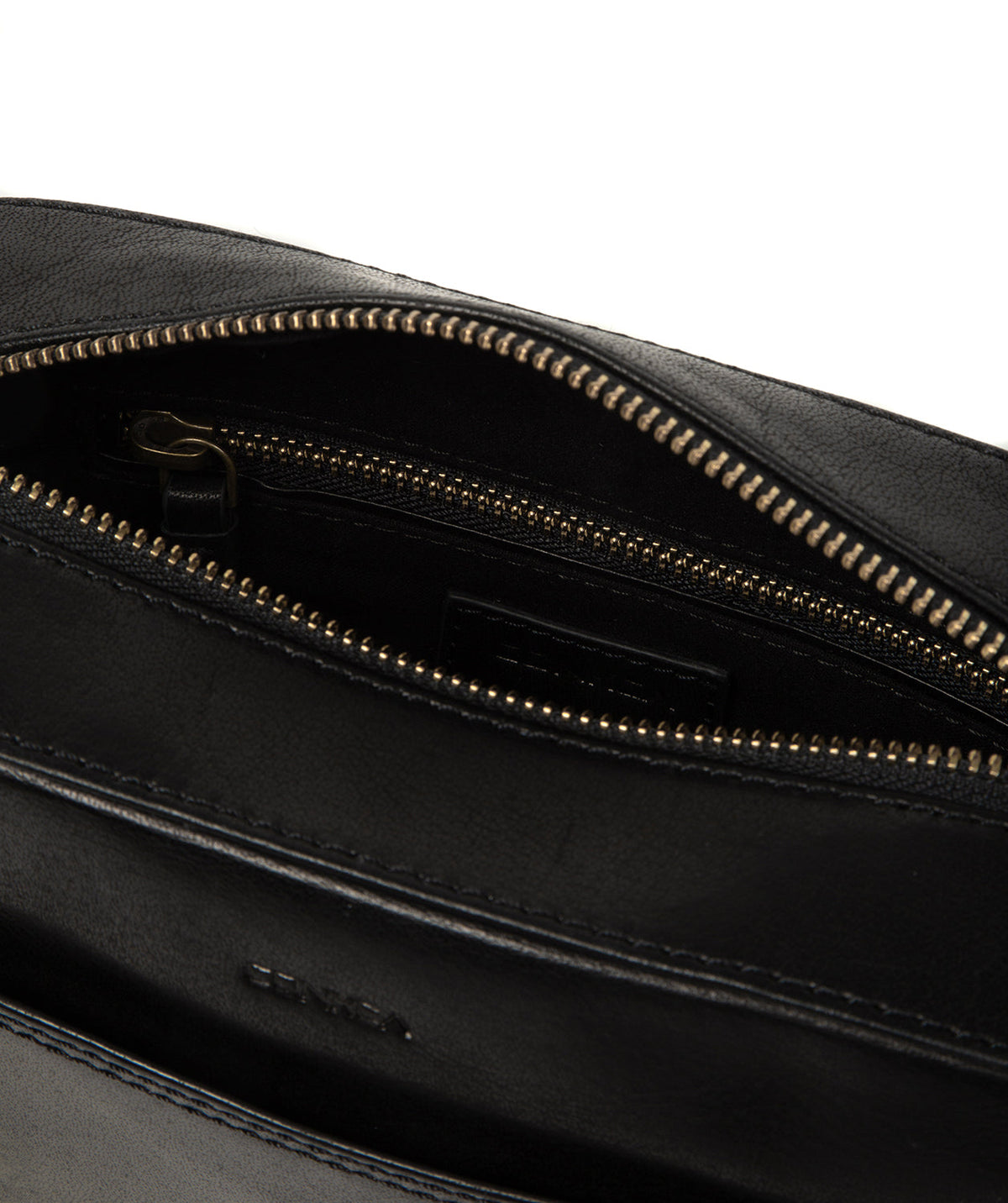Side profile showing brass hardware and embossed logo