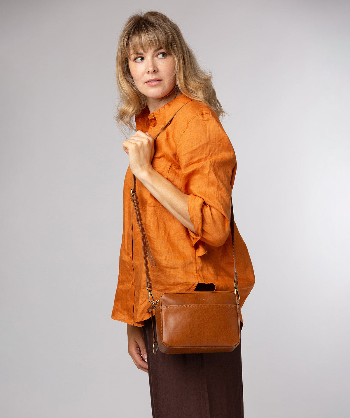 Meadow crossbody bag side profile with adjustable leather strap
