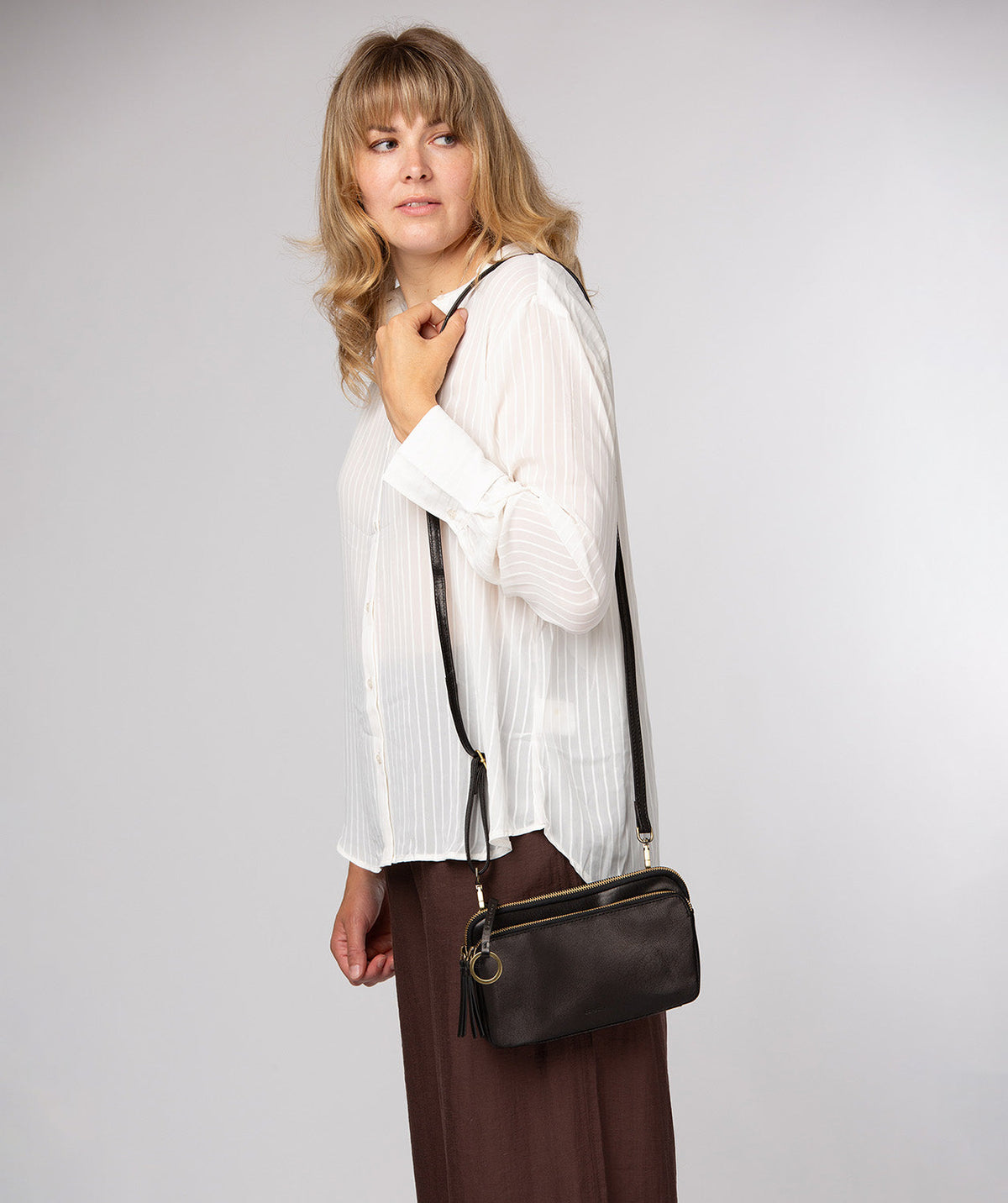 Birdy crossbody bag side profile with adjustable shoulder strap