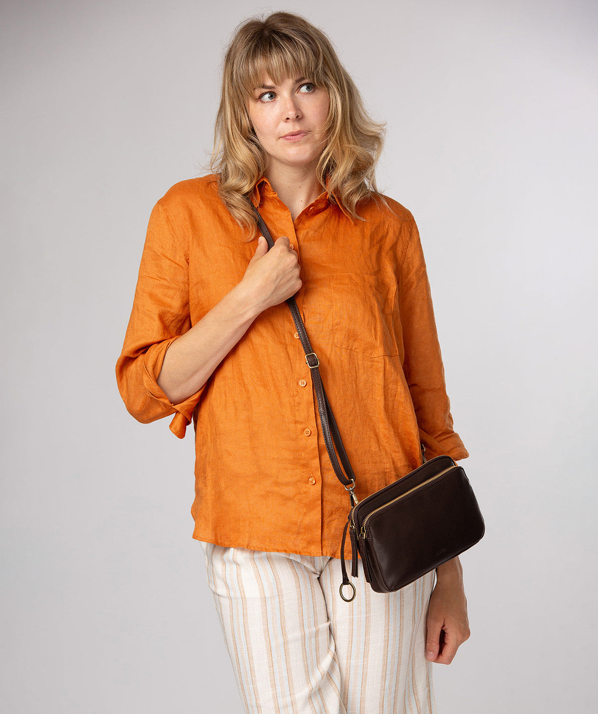 Conkca London Birdy cocoa leather crossbody bag front view