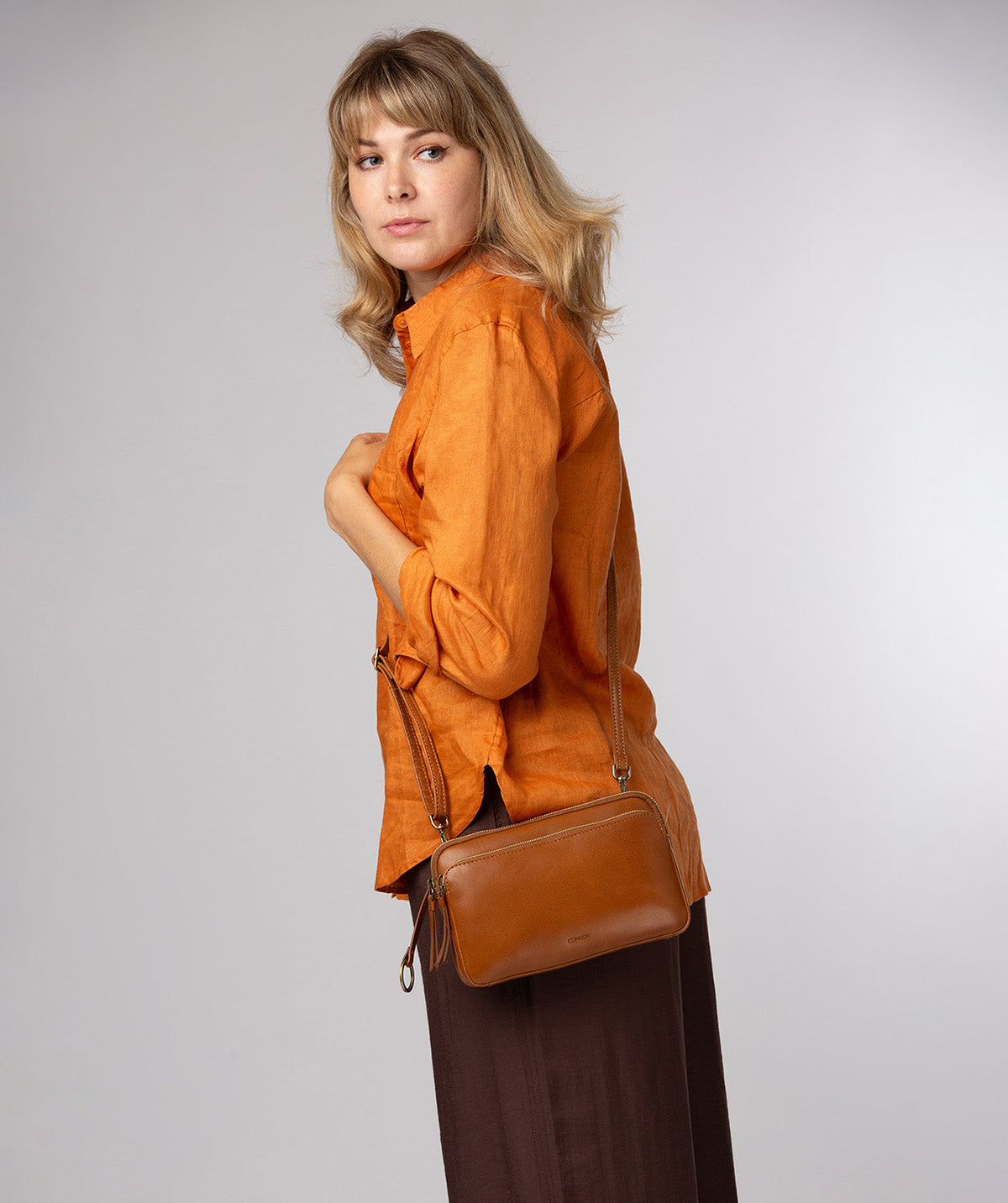 Birdy crossbody bag side profile with adjustable shoulder strap