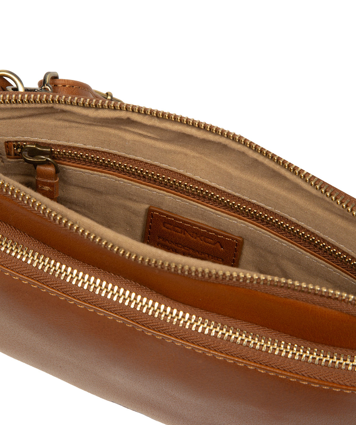 Exterior front zipped pocket and brass hardware