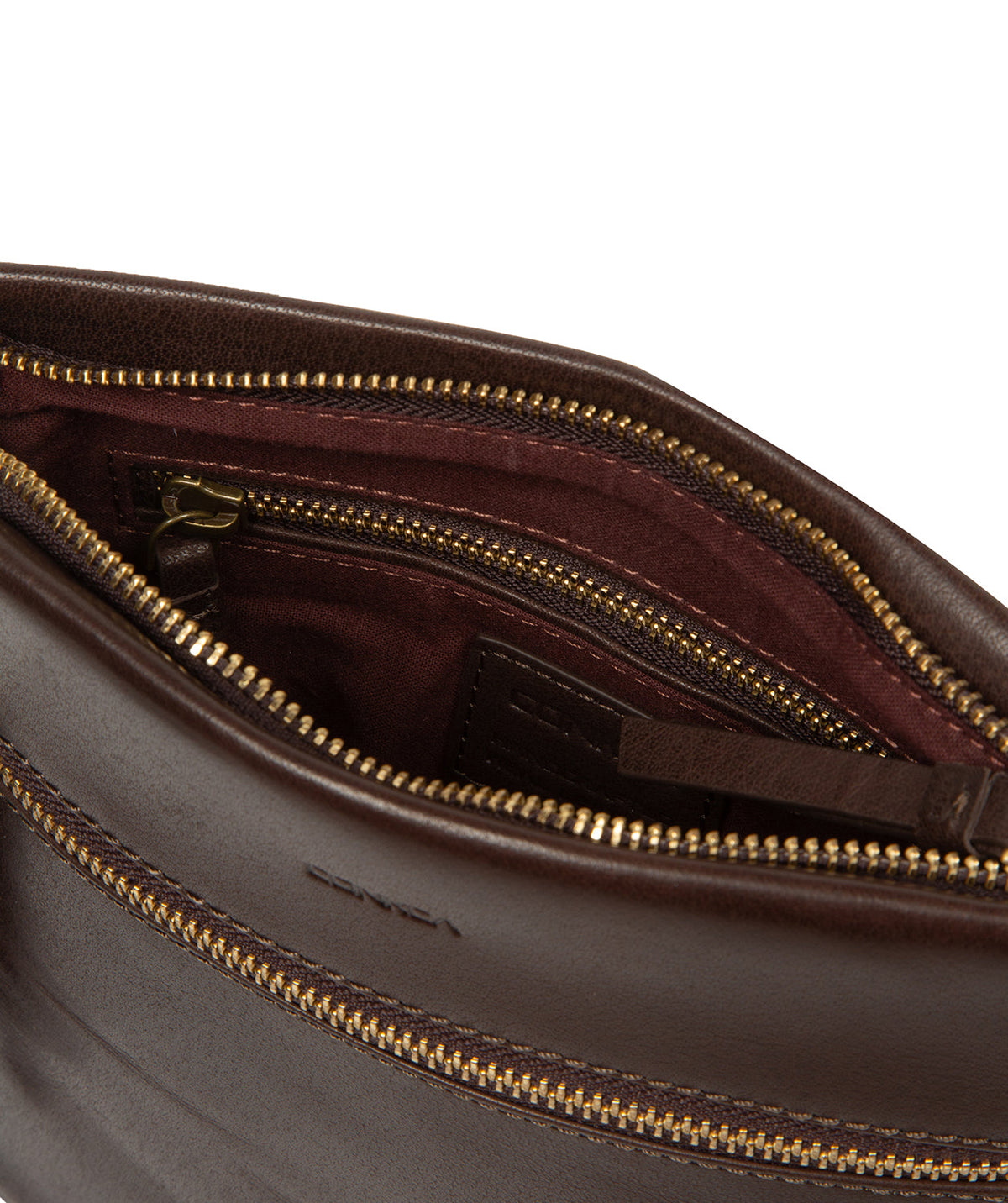 Brass hardware and zip closure detail on cocoa leather