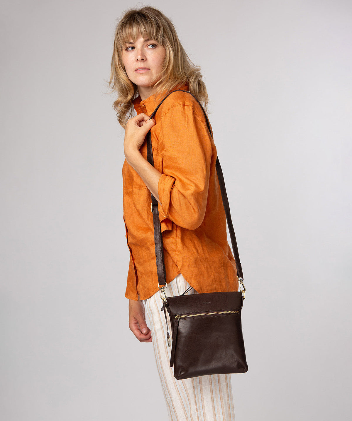 Minimalist Conkca charm and refined finishing touch