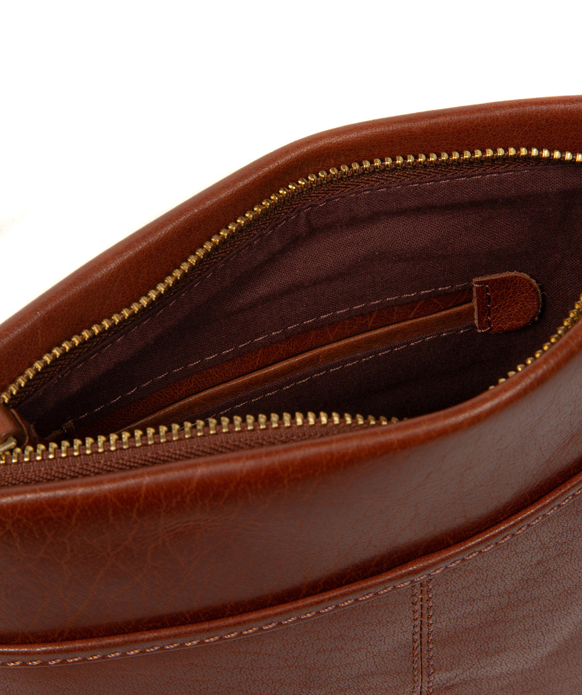 Full bag flat lay showing natural leather texture