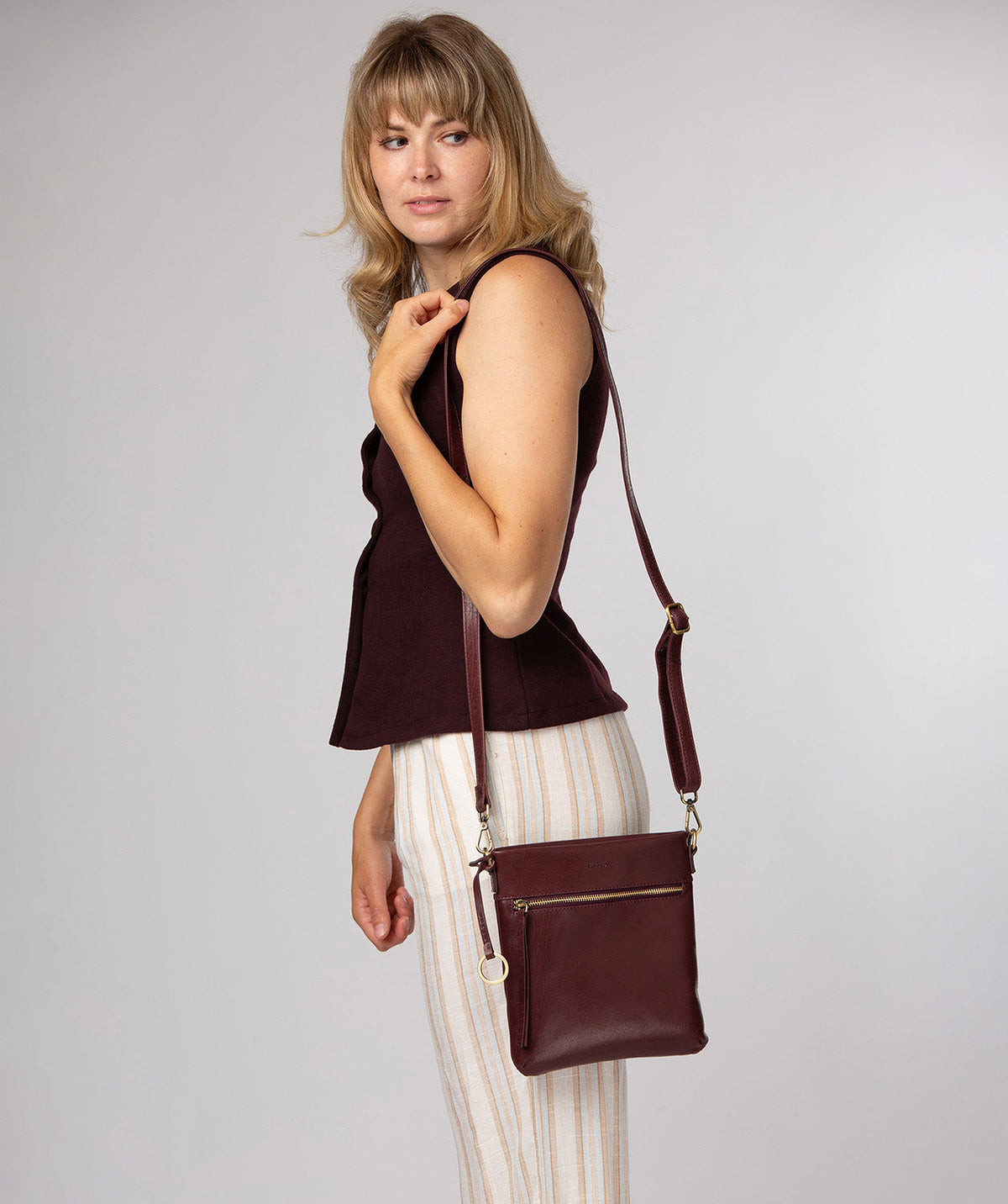 Conkca London Dove plum leather crossbody bag front view