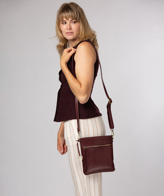 Conkca London Dove plum leather crossbody bag front view