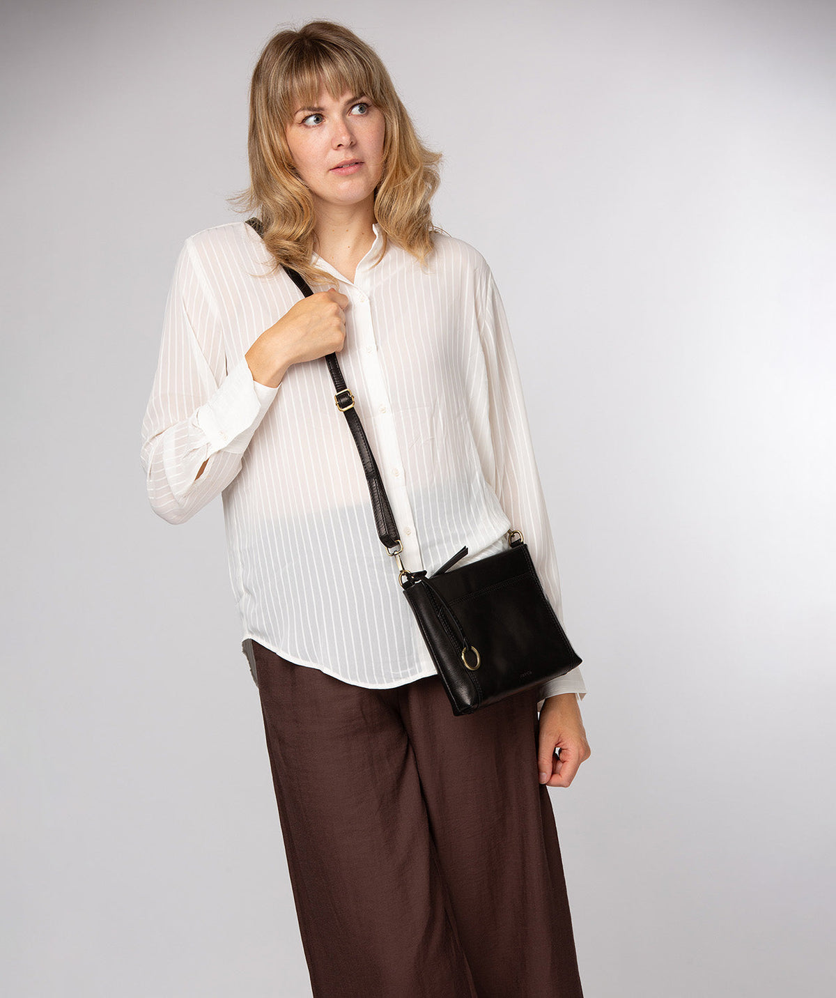 Conkca London Yew black leather crossbody bag front view