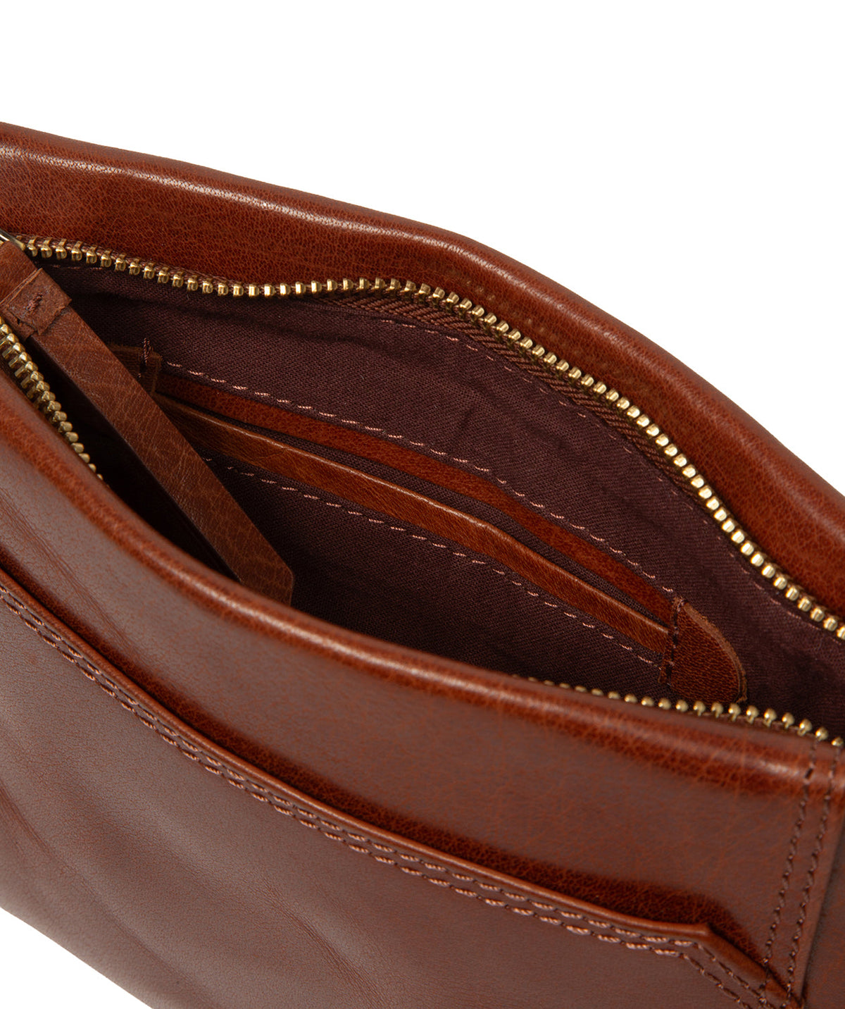 Worn crossbody style with embossed Conkca logo charm
