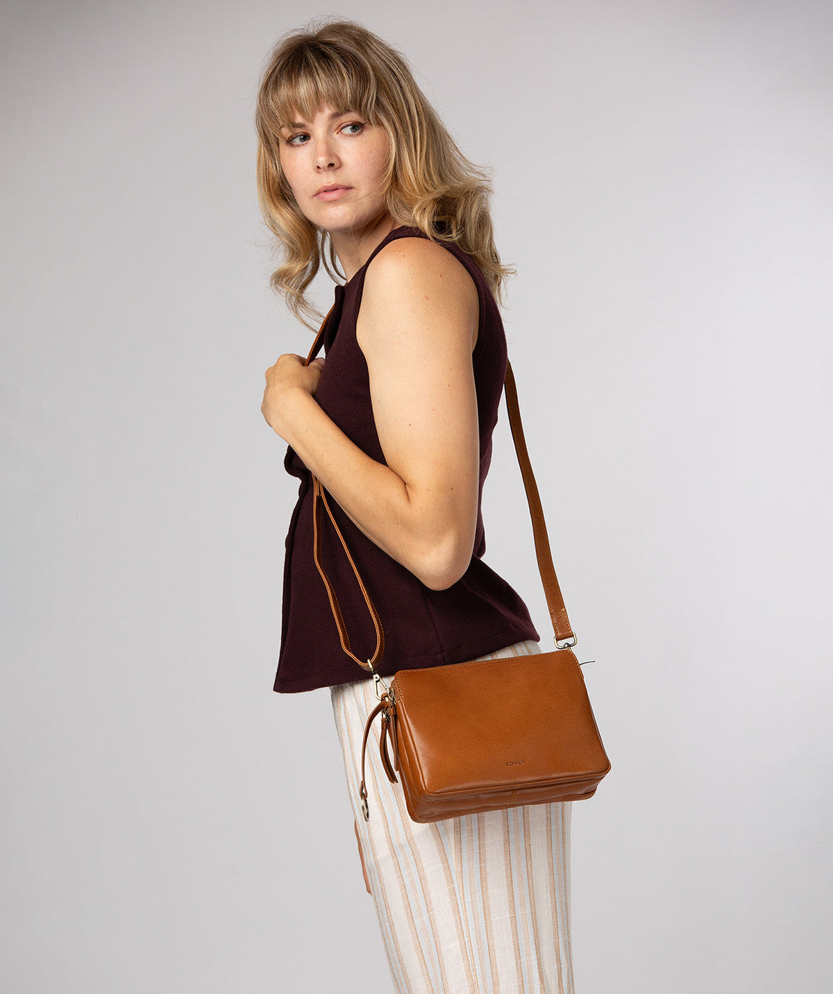 Robin crossbody bag side profile with adjustable shoulder strap