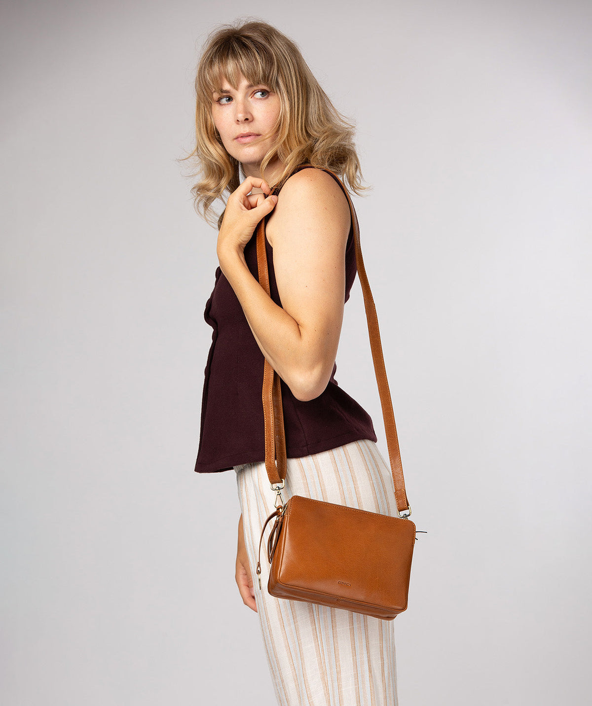 Robin crossbody bag worn over shoulder styling