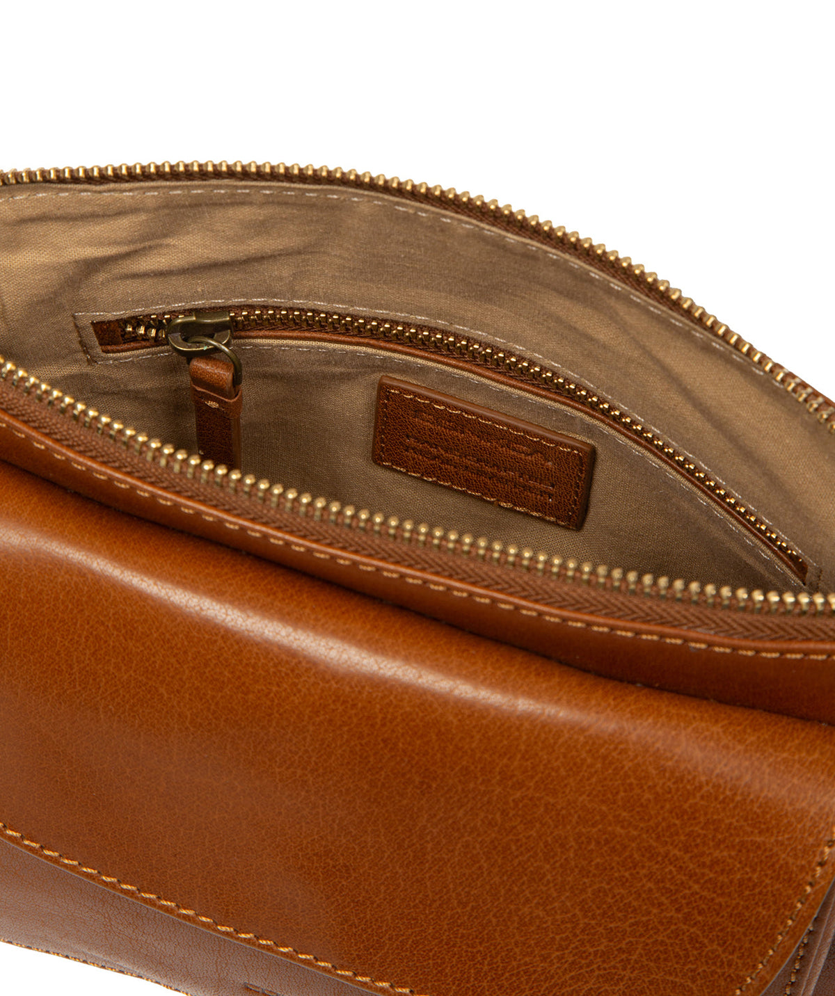 Zip-over top closure and brass-coloured metal hardware detail