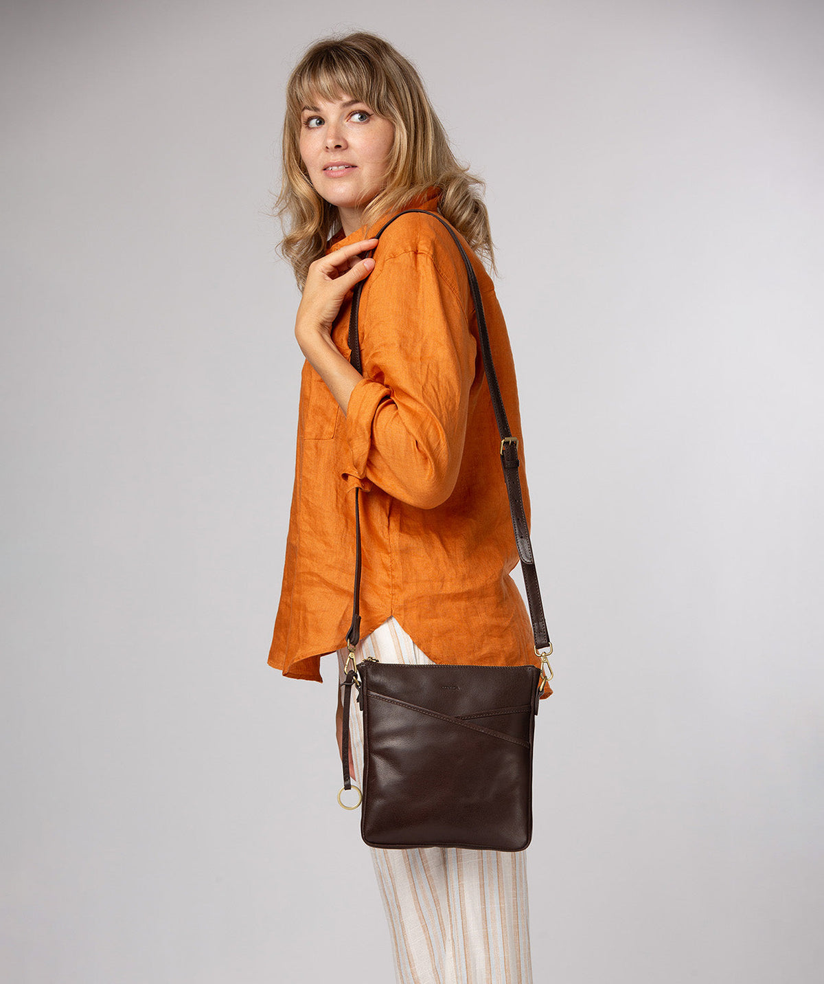 Holly bag side profile showing natural leather texture