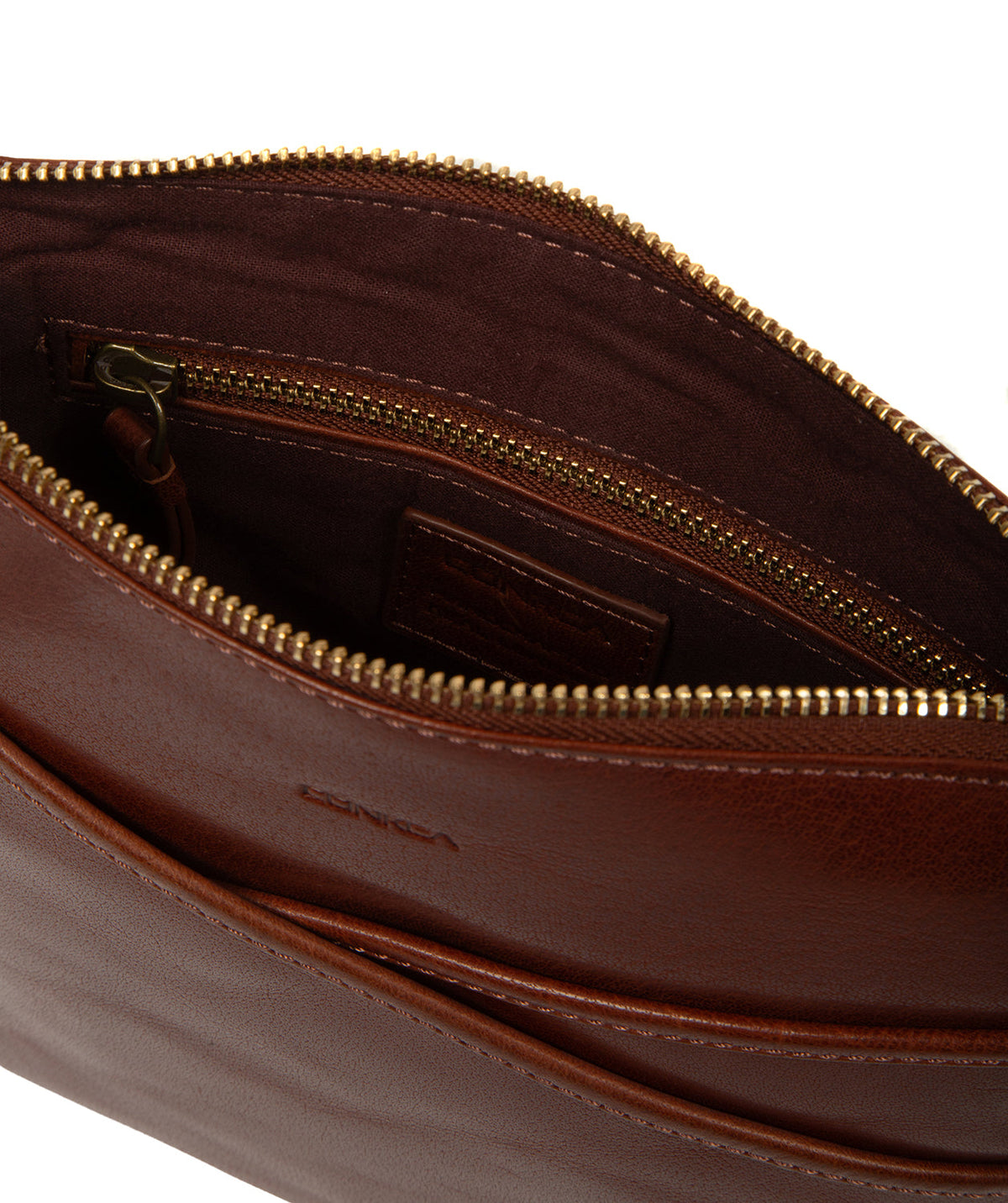 Interior lined pocket and zip closure detail