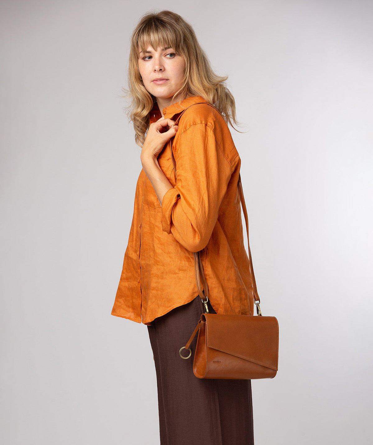 Fold-over magnetic closure and angled top detail